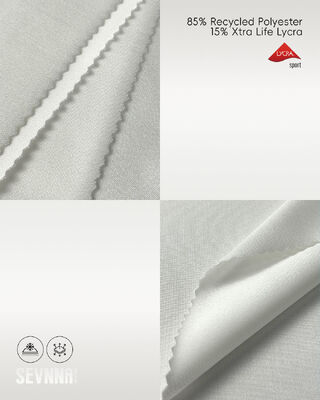 Tejido elástico de Lycra con 85% de poliéster reciclado, protección UV y absorción de humedad para ropa deportiva y de baño